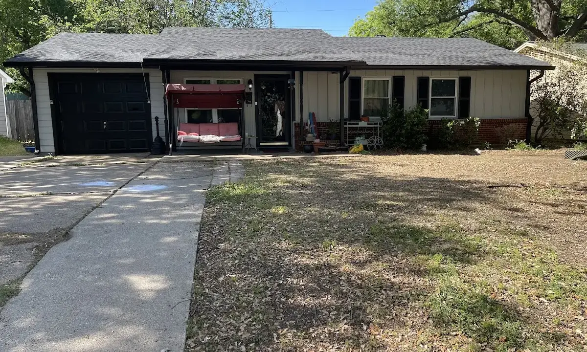 Asphalt Shingle Roof Repair crew at work on a residential roof in Oakleaf Plantation